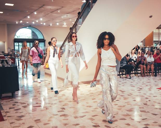 Models present luxury fashion at Neiman Marcus St. Louis. Source: St. Louis American